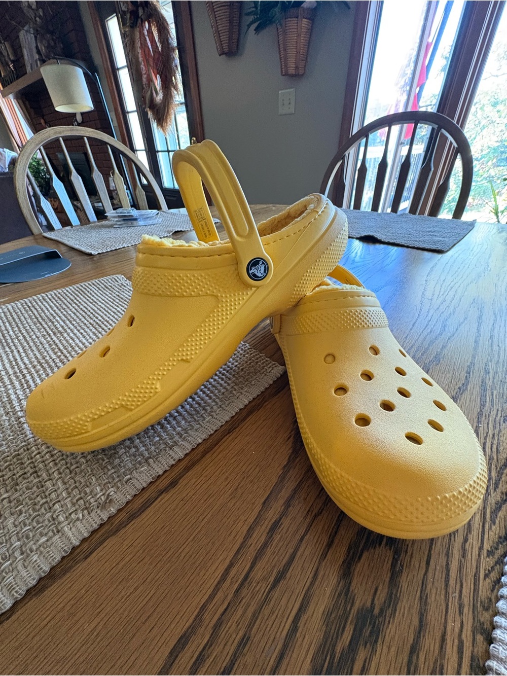 Bright yellow sherpa lined crocs